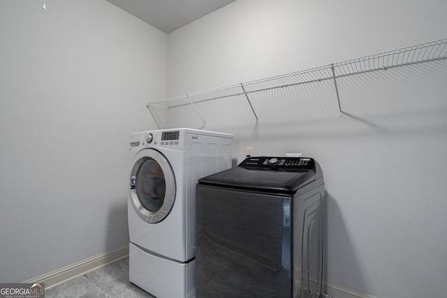 washroom featuring separate washer and dryer