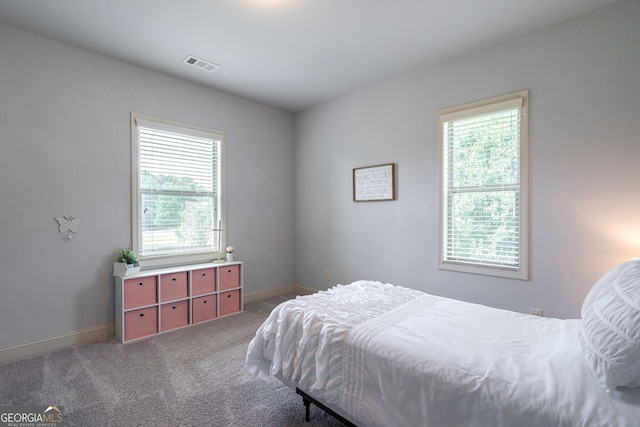 bedroom featuring dark colored carpet