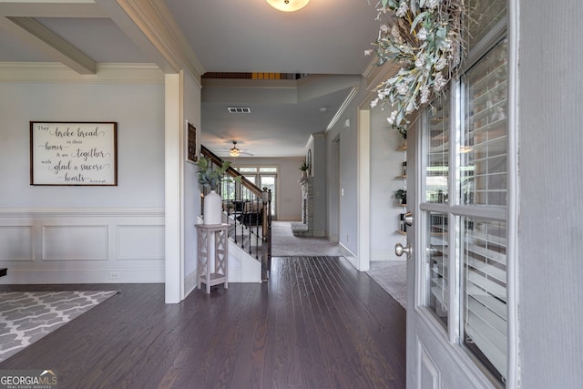 entrance foyer featuring crown molding and dark hardwood / wood-style floors