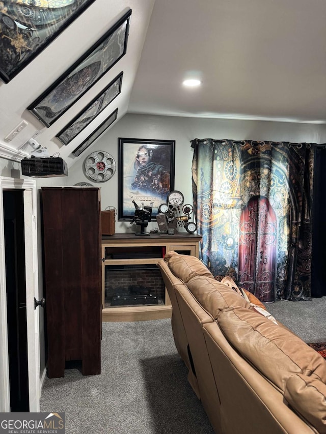 carpeted living room featuring vaulted ceiling