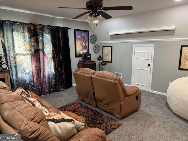 home theater room with ceiling fan and carpet