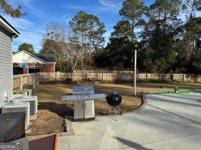 view of patio featuring grilling area and central air condition unit