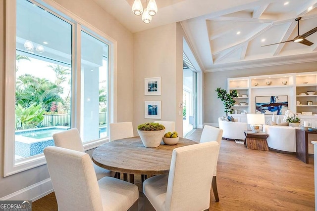 dining room with baseboards, coffered ceiling, crown molding, light wood-style floors, and beam ceiling