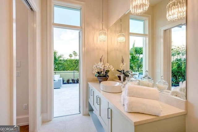 bathroom featuring vanity and a notable chandelier