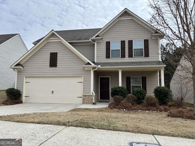 view of front of home with a garage and covered porch