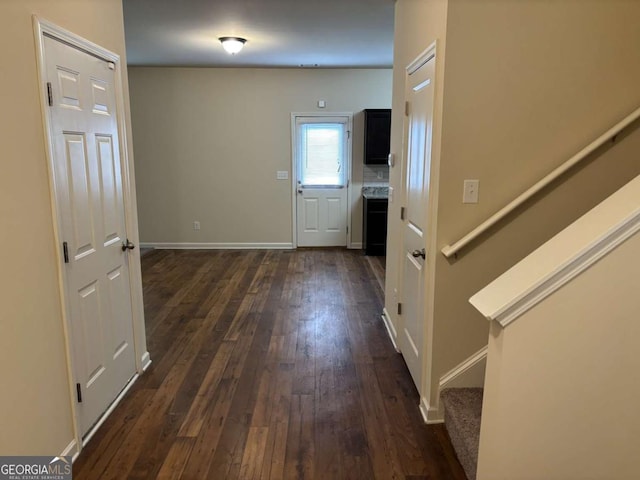 corridor featuring dark hardwood / wood-style flooring