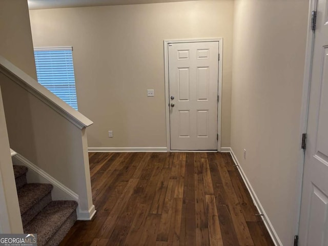 foyer with dark hardwood / wood-style floors