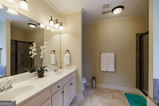 bathroom featuring vanity, crown molding, a shower with door, and toilet