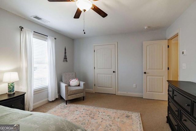 bedroom with light colored carpet and ceiling fan