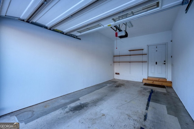 garage featuring a garage door opener