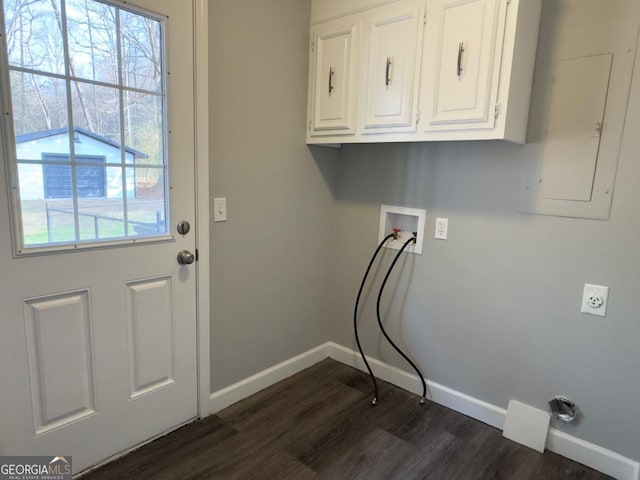 laundry room featuring cabinets, plenty of natural light, dark hardwood / wood-style floors, and washer hookup