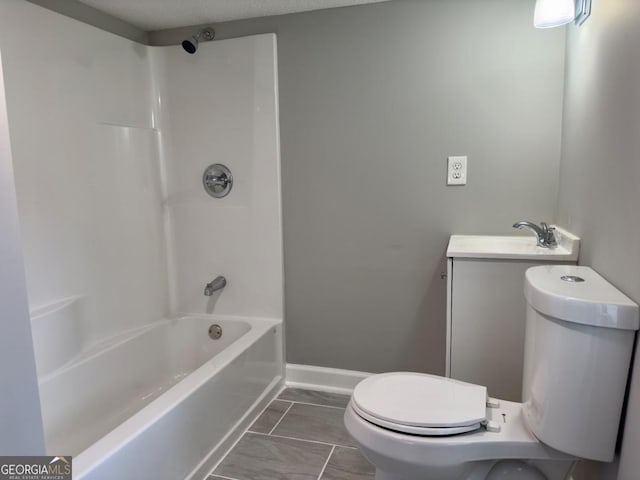 full bathroom with vanity, bathtub / shower combination, and toilet