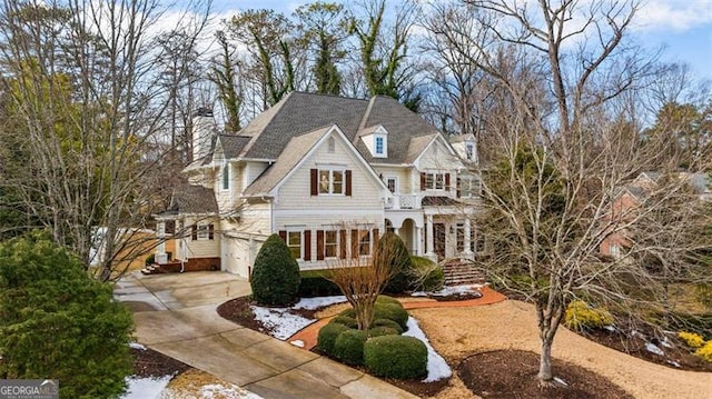 craftsman-style house with a garage and a balcony