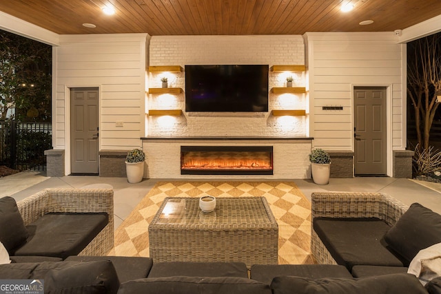 living room with wood ceiling, a fireplace, brick wall, and wood walls