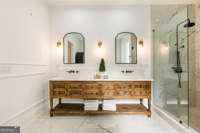 bathroom with vanity and a tile shower