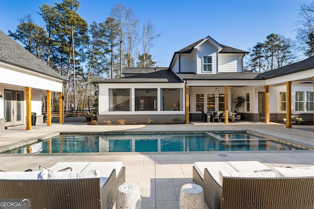 view of swimming pool featuring an outdoor living space and a patio area