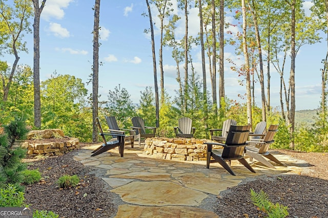 view of patio / terrace featuring an outdoor fire pit