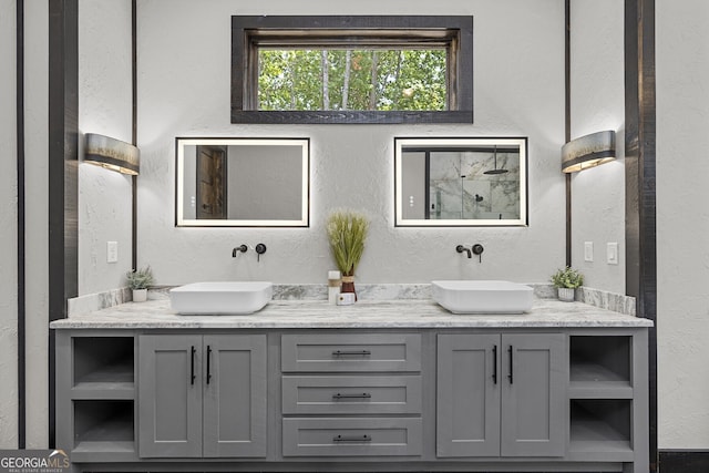 bathroom featuring vanity and a shower