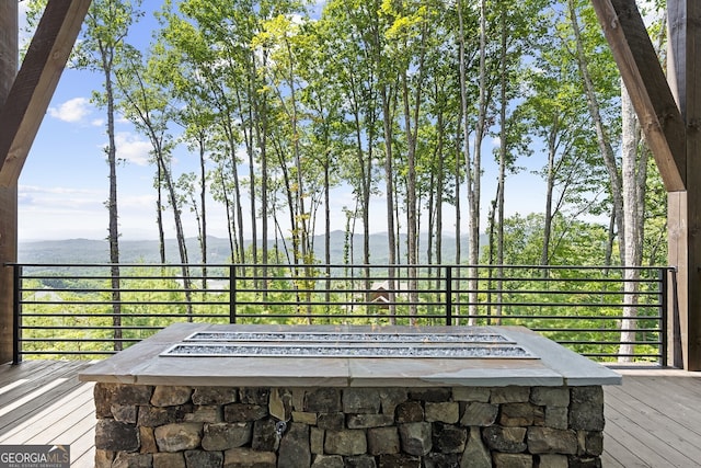 details featuring a mountain view and a fire pit