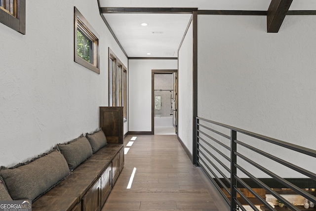 hall featuring beamed ceiling and dark wood-type flooring