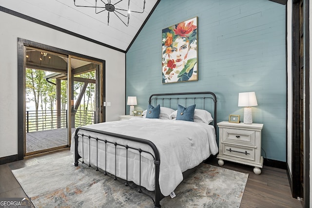 bedroom with dark hardwood / wood-style floors, access to outside, and high vaulted ceiling