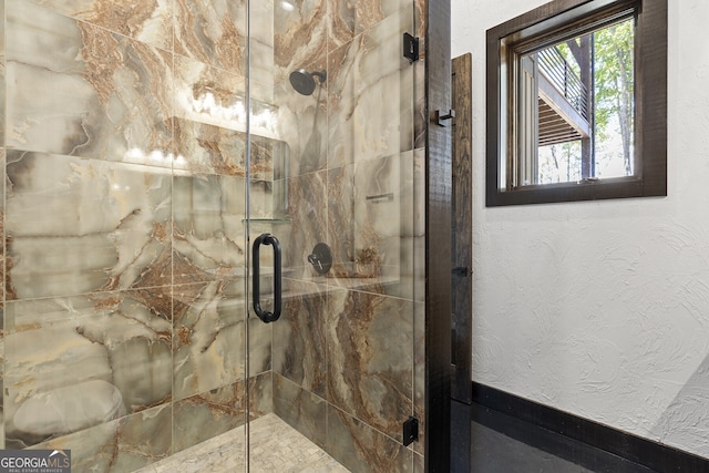 bathroom featuring an enclosed shower