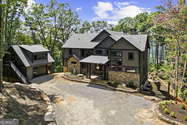 view of front of home featuring a porch and a garage