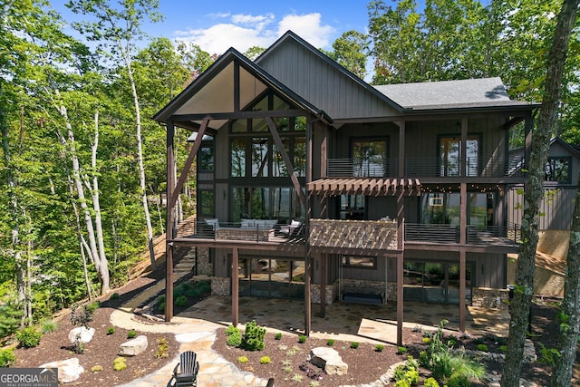 back of property with a patio and a balcony