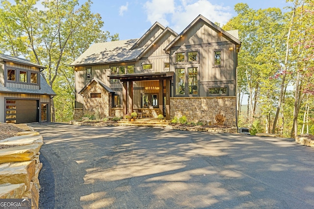 view of front of property featuring a garage and covered porch