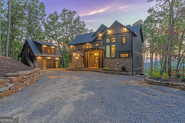 modern inspired farmhouse with a garage