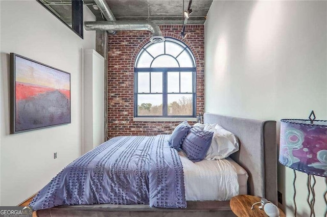 bedroom with brick wall