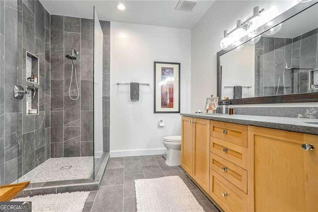 full bath with double vanity, visible vents, toilet, and a tile shower