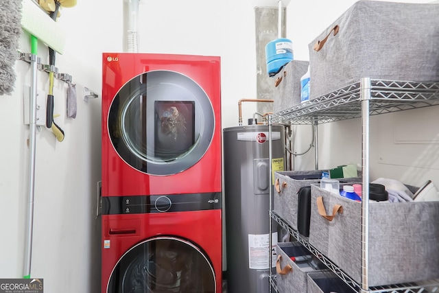 clothes washing area featuring electric water heater, stacked washer and clothes dryer, and laundry area