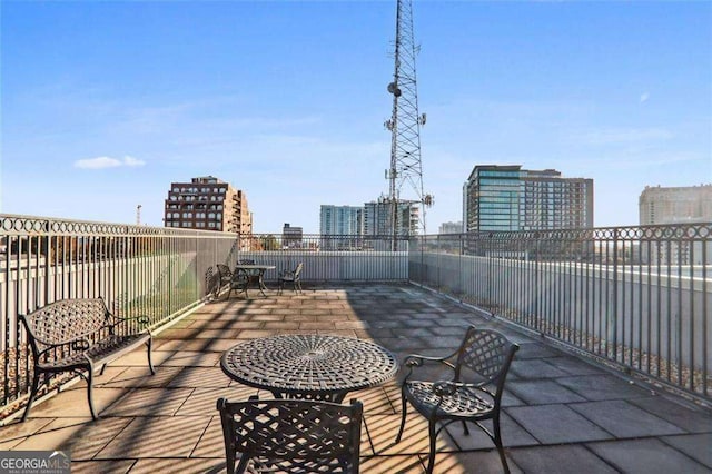 view of patio / terrace featuring a city view