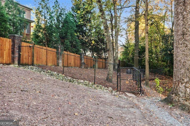 view of yard with a gate and fence