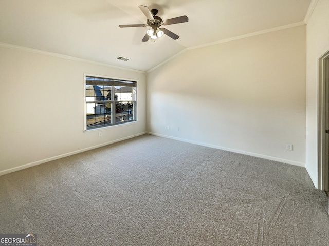 unfurnished room with lofted ceiling, carpet floors, ornamental molding, and ceiling fan