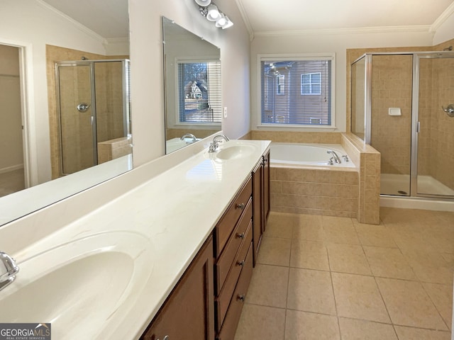 bathroom featuring tile patterned flooring, crown molding, vanity, and plus walk in shower