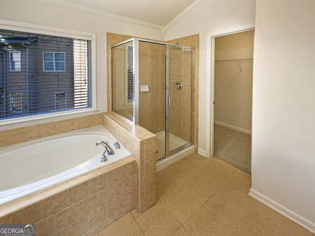 bathroom featuring crown molding and plus walk in shower