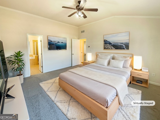 bedroom with lofted ceiling, connected bathroom, carpet floors, and ornamental molding