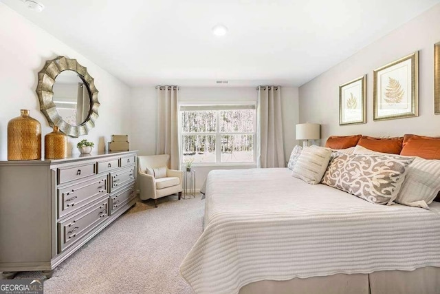 bedroom featuring light colored carpet