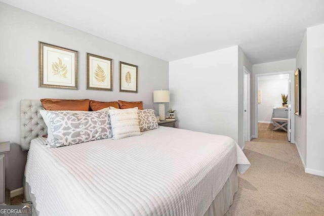 bedroom with light colored carpet