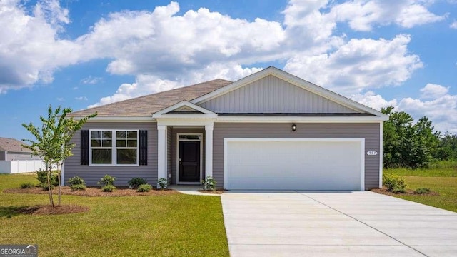 view of front of home with a garage and a front yard