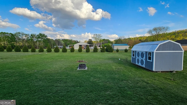 214 Harris St, Chatsworth, GA 30705 - view of yard with an outbuilding, an outdoor fire pit, and a shed