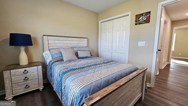 214 Harris St, Chatsworth, GA 30705 - bedroom featuring dark wood-type flooring, baseboards, and a closet