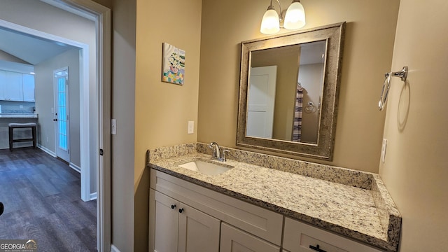 214 Harris St, Chatsworth, GA 30705 - bathroom with baseboards, wood finished floors, and vanity