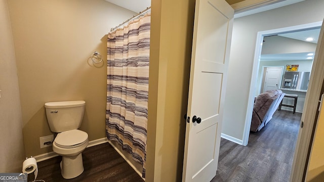 214 Harris St, Chatsworth, GA 30705 - bathroom featuring baseboards, wood finished floors, toilet, and curtained shower