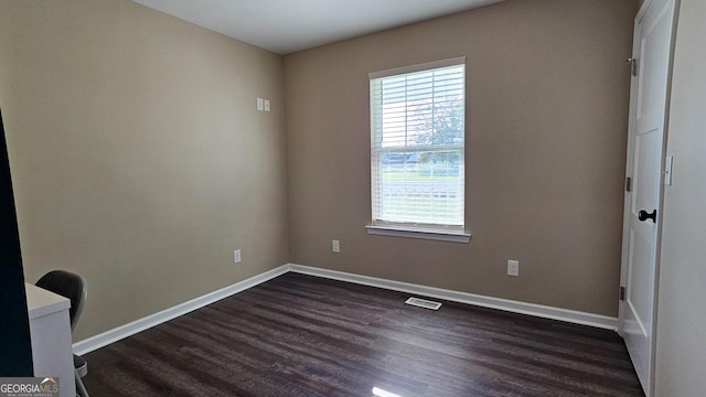 214 Harris St, Chatsworth, GA 30705 - unfurnished room featuring baseboards, dark wood-style floors, and visible vents
