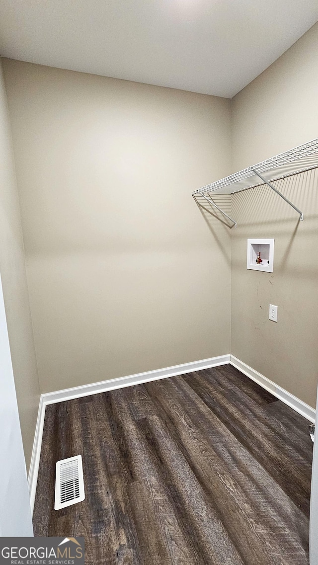 214 Harris St, Chatsworth, GA 30705 - spacious closet with dark wood-style floors and visible vents