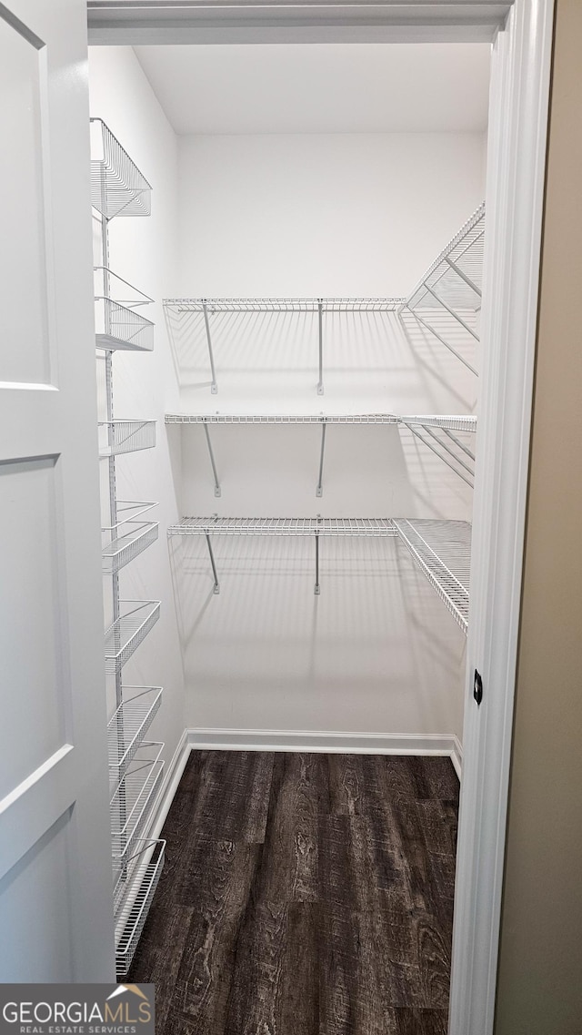 214 Harris St, Chatsworth, GA 30705 - spacious closet featuring dark wood-style floors