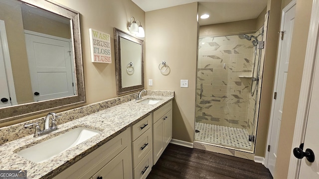 214 Harris St, Chatsworth, GA 30705 - full bathroom featuring a sink, a shower stall, and wood finished floors